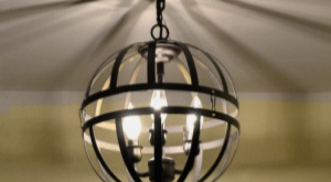 Transform an outdated chandelier into a modern orb pendant light with hanging flower baskets