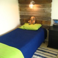 inspiration files--weathered wood headboard with overhead light from southern fried living