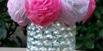 Flower vase made from a mayonaise jar covered in clear marbles