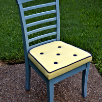 Reupholstered dining chair with welt cord and buttons