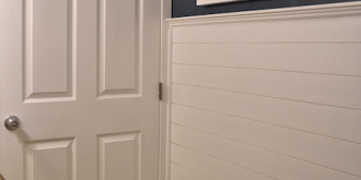 Faux wood plank wall treatment with horizontal slats