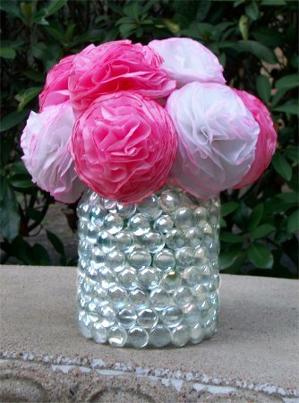 Flower vase made from a mayonnaise jar and clear marbles