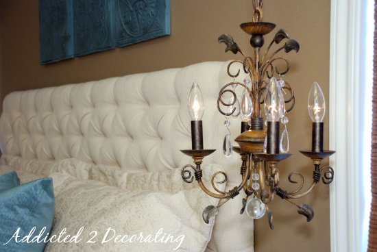 Master bedroom makeover--small chandelier, chandelier used in place of bedside lamp.