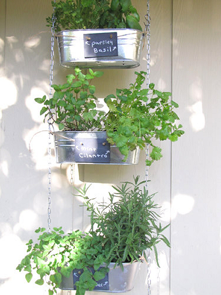 Make a hanging herb garden from metal containers, chain, and S-hooks