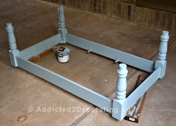 Coffee table makeover - old top removed, and base in process of being painted a light blue color