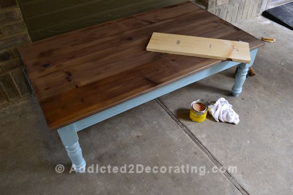 Comparison of raw pine, pine stained with vinegar and steel wool mixture, and stained wood with wax topcoat