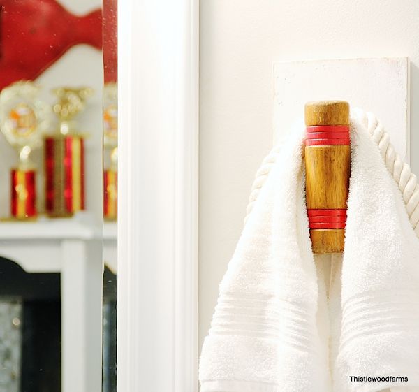 Turn unused croquet mallets into unique towel hooks for your bathroom, and easy DIY project.