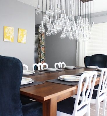 DIY chandelier created with 80 light bulbs and wiring
