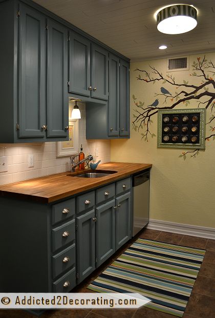 Condo kitchen with light buttery yellow walls - Behr Rich Cream