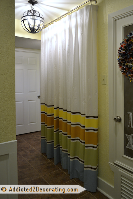 condo hallway makeover with curtains with painted stripes