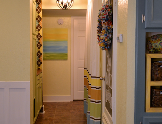 Small condo laundry room disguised as a hallway