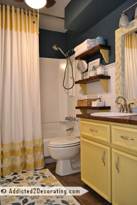 small condo bathroom makeover with painted vanity, DIY shower curtain, and DIY wood countertop