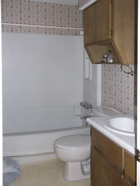 Small bathroom before makeover with apartment grade fixtures before makeover