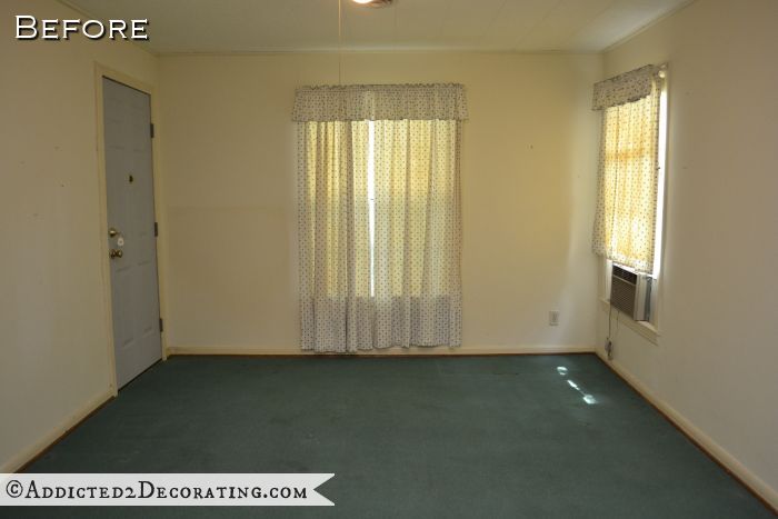 Bedroom with original hardwood floors covered by carpet