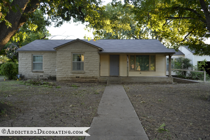 House with overgrown boxwoods removed