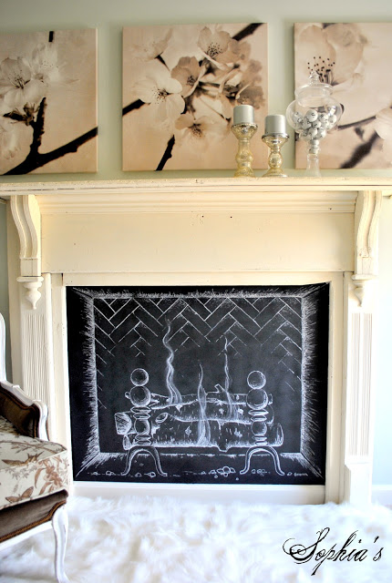 Faux fireplace with chalk drawn bricks, logs, and fire