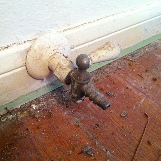 Vintage gas valves in the wall of a 1948 house