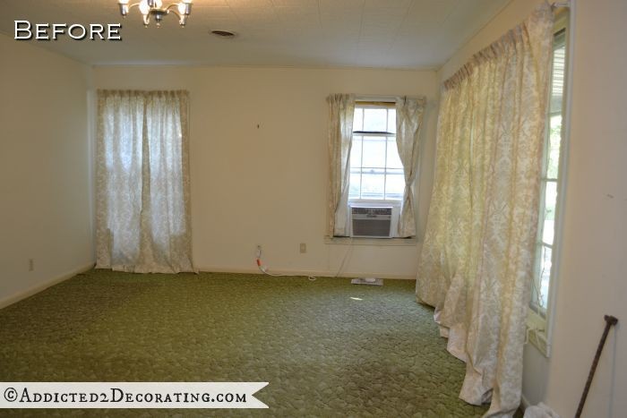 Living room with original hardwood floors covered with carpet