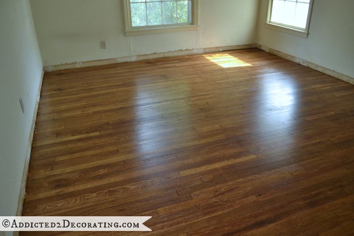 Master bedroom after old carpet was removed and the original 65-year-old hardwood floors refinished