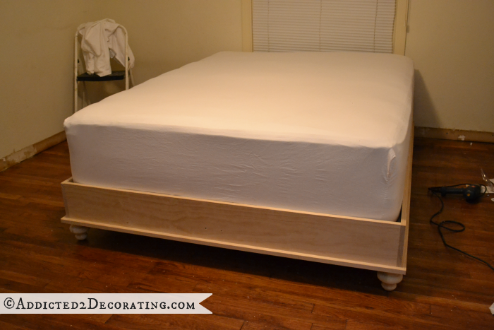 DIY raised platform bed frame without the decorative trim, from Addicted2Decorating.com