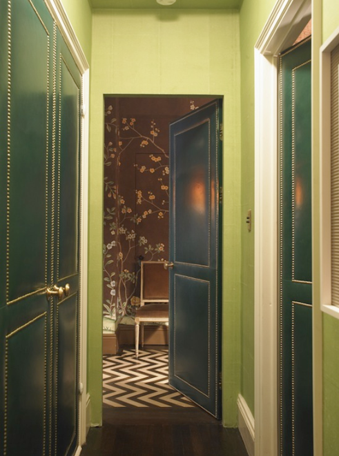 Green leather hallway doors with nailhead trim accent by Miles Redd
