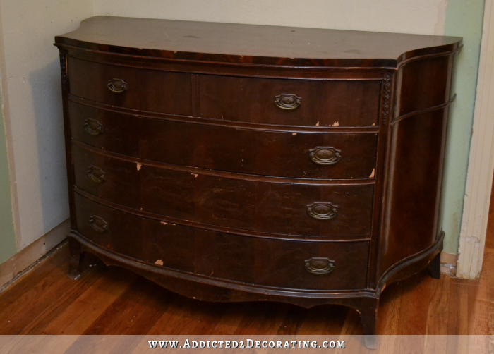 Antique credenza with peeling and cracked veneer