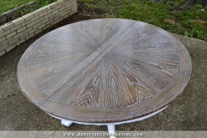 Dining table after DIY makeover -- cerused oak top with painted white pedestal base
