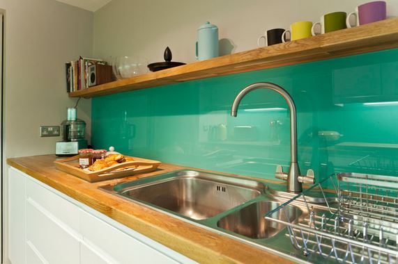 Kitchen with green back painted glass backsplash from DHV Architects, via Houzz.com