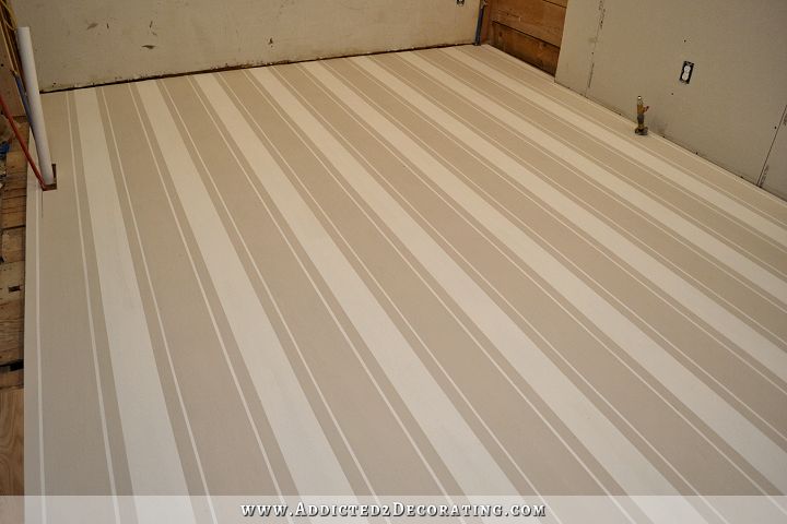 painted hardwood floor with white and tan stripes
