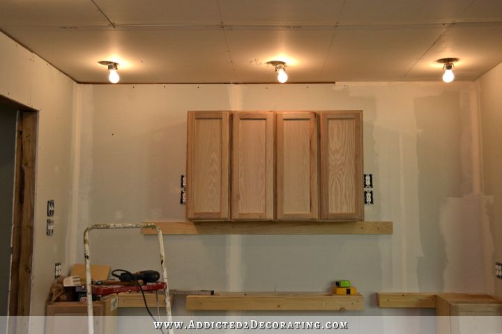 installing upper cabinets 3