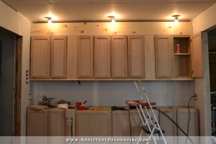 wall of cabinets -- finishing the top cabinets - 2