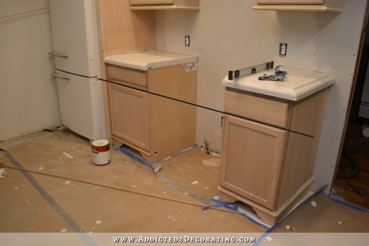 adding gold leaf to kitchen cabinets - 4
