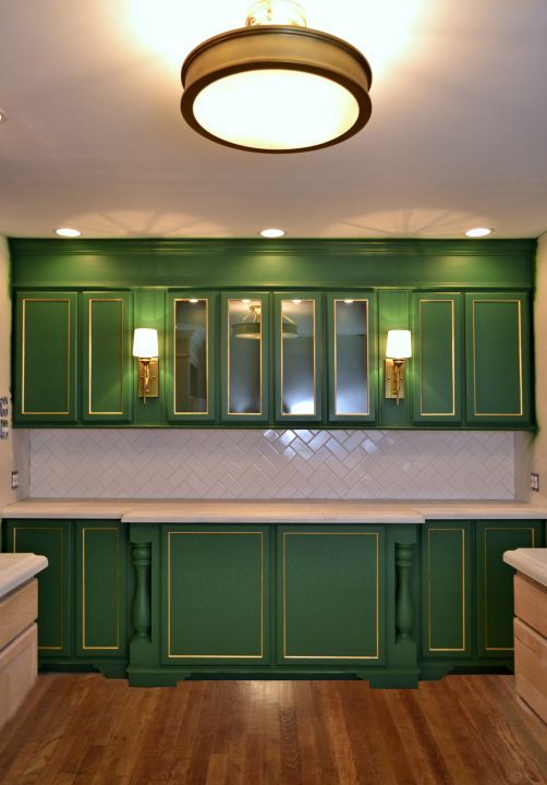 wall of cabinets with stained hardwood floor