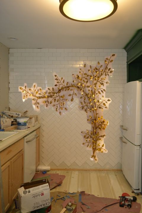 artwork for the kitchen - tiled wall with gold tree sculpture