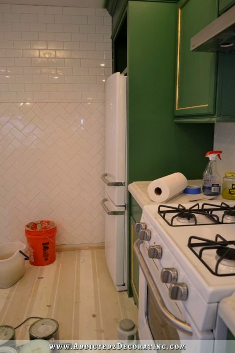 kitchen progress - door swing on refrigerator changed and refrigerator leveled