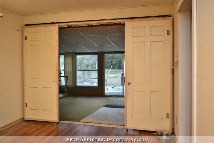 Inexpensive DIY barn door style rolling doors with cheap $60 hardware