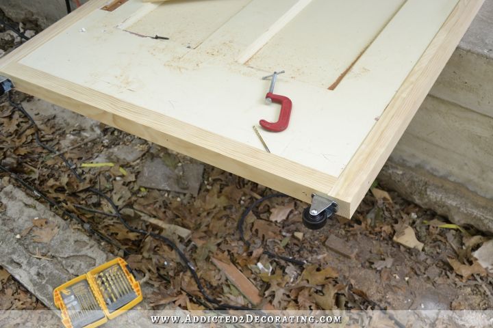 DIY rolling barn doors - add casters to bottom of doors