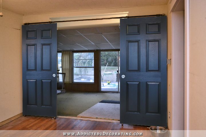 Rolling barn door style doors painted solid black