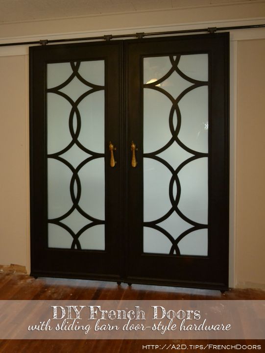 DIY French doors with circle fretwork panels, installed in inexpensive DIY barn door hardware