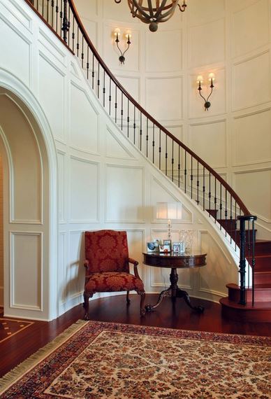 Beautiful wall trim molding - entryway and staircase design by Phillip W Smith General Contractor, Inc.