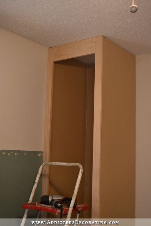 DIY cabinet style bedside closet - attach the top rail