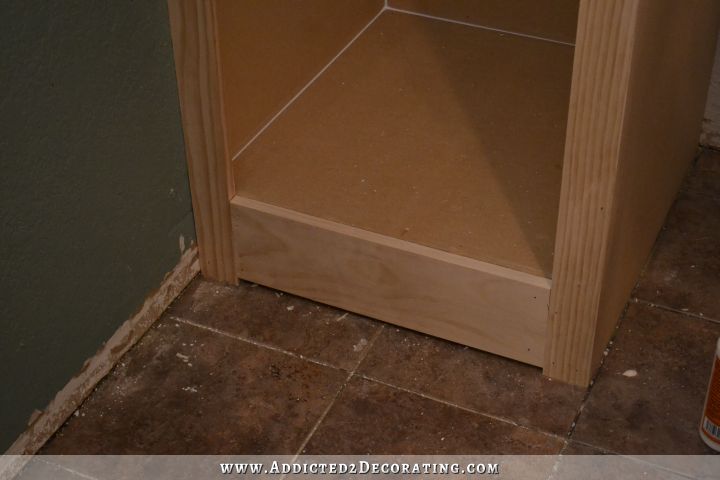 DIY cabinet style bedside closet - attach bottom rail