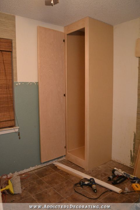 DIY bedside corner closet to maximize storage in a small bedroom