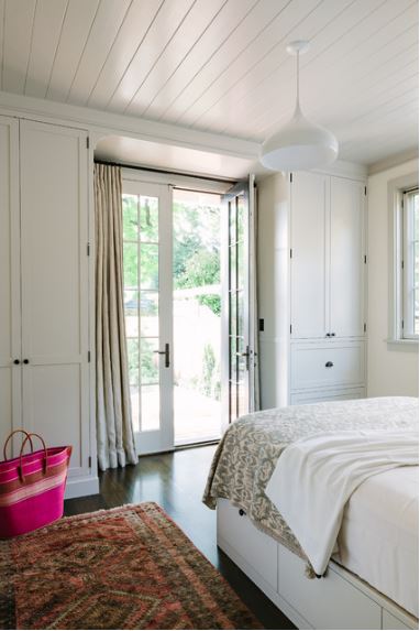 closets flanking door - Sellwood Library House bedroom by The Works general contractors