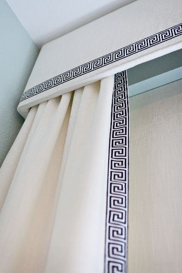 window treatments with upholstered cornice and side panels with Greek key trim by Abbe Fenimore Studio Ten 25,via Houzz