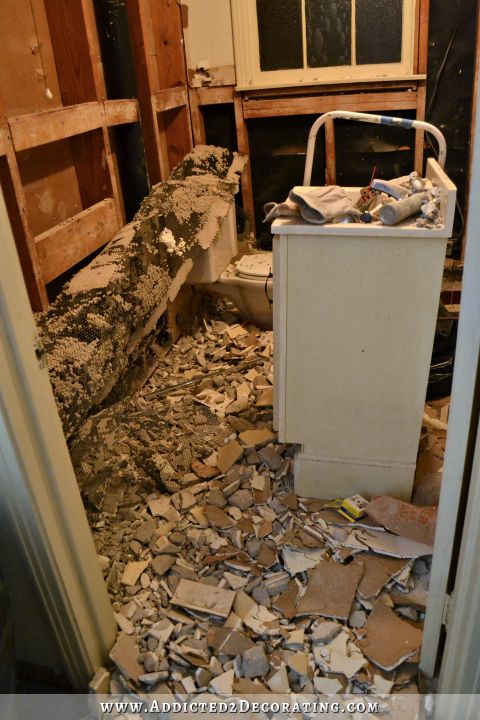 bathroom demolition for remodel - removing tile, thick mortar bed, and wire from walls in late 1940s / early 1950s bathroom