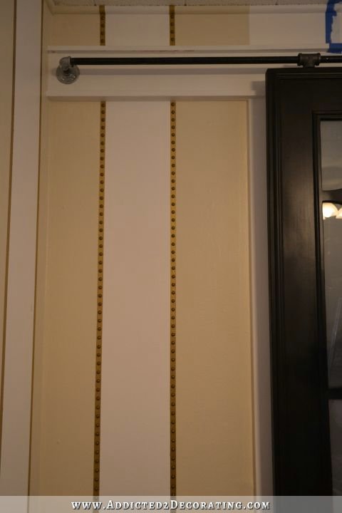 striped walls with nailhead trim accents - 5