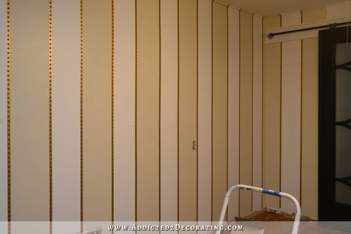 striped walls with nailhead trim accents - 7