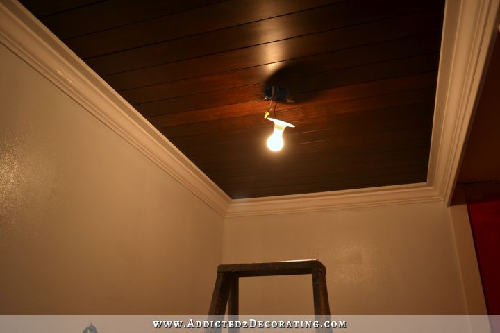 stained wood slat ceiling in hallway bathroom - 4