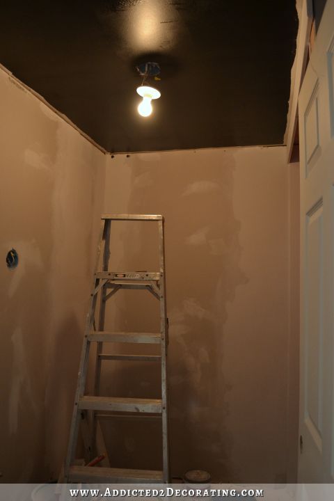 wood slat ceiling - ceiling painted black before installation